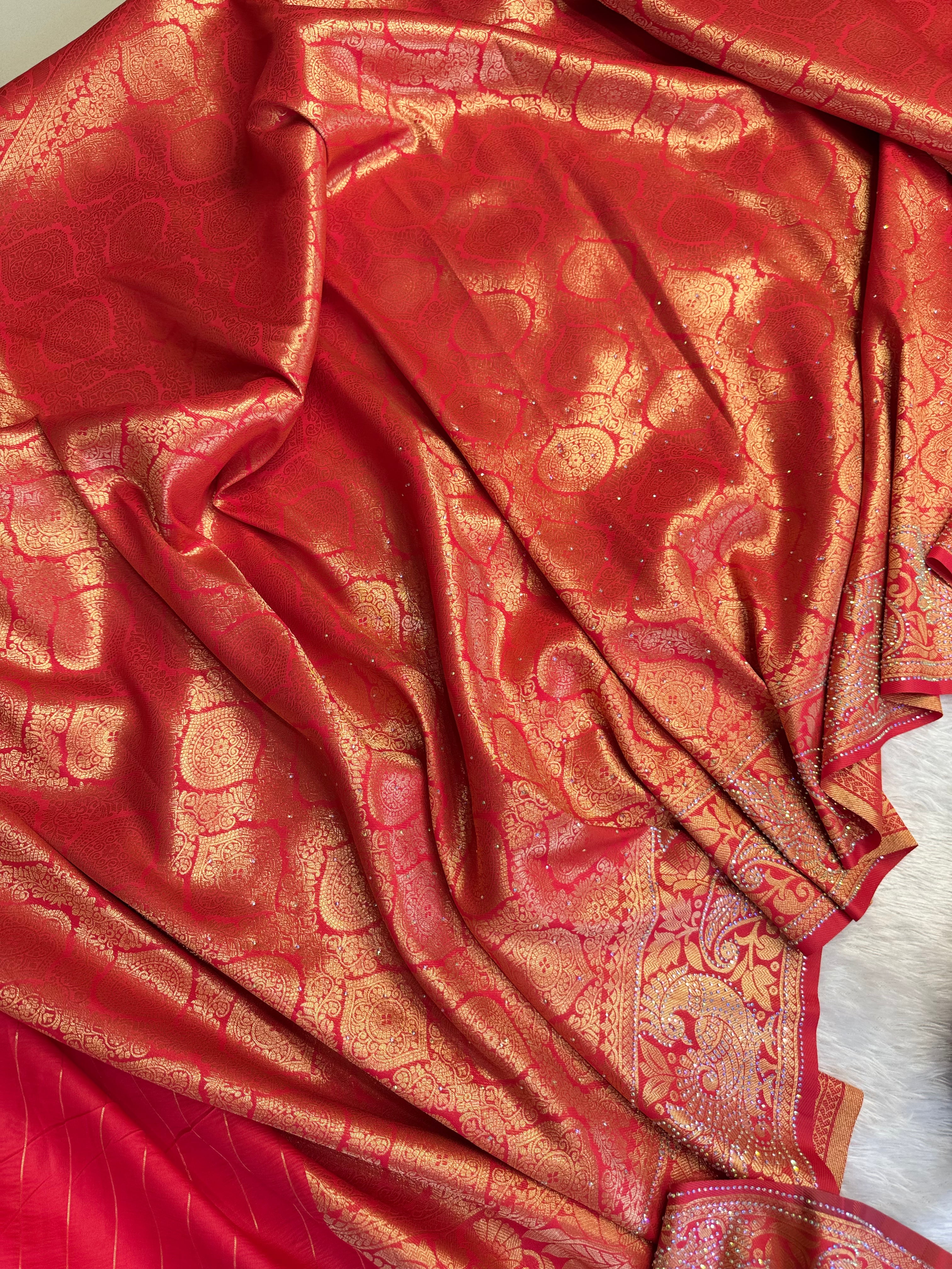 Red Festive Saree with Heavy Zari Work and Traditional Artistic Border