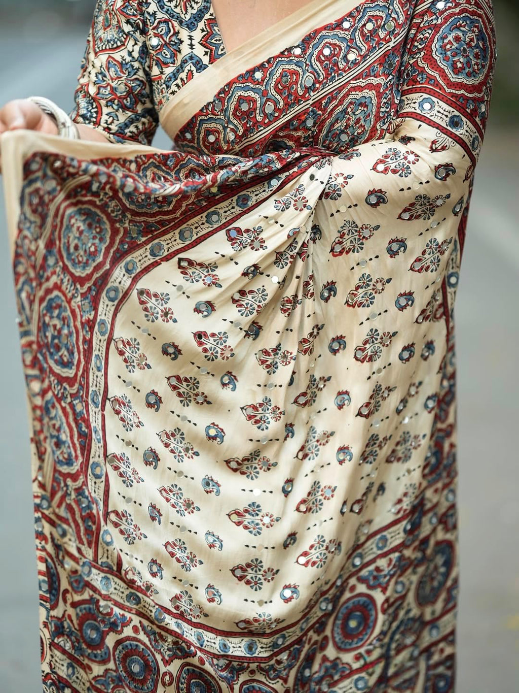 Designer Cream Printed Saree with Traditional Motifs, Border & Tassel Detailing