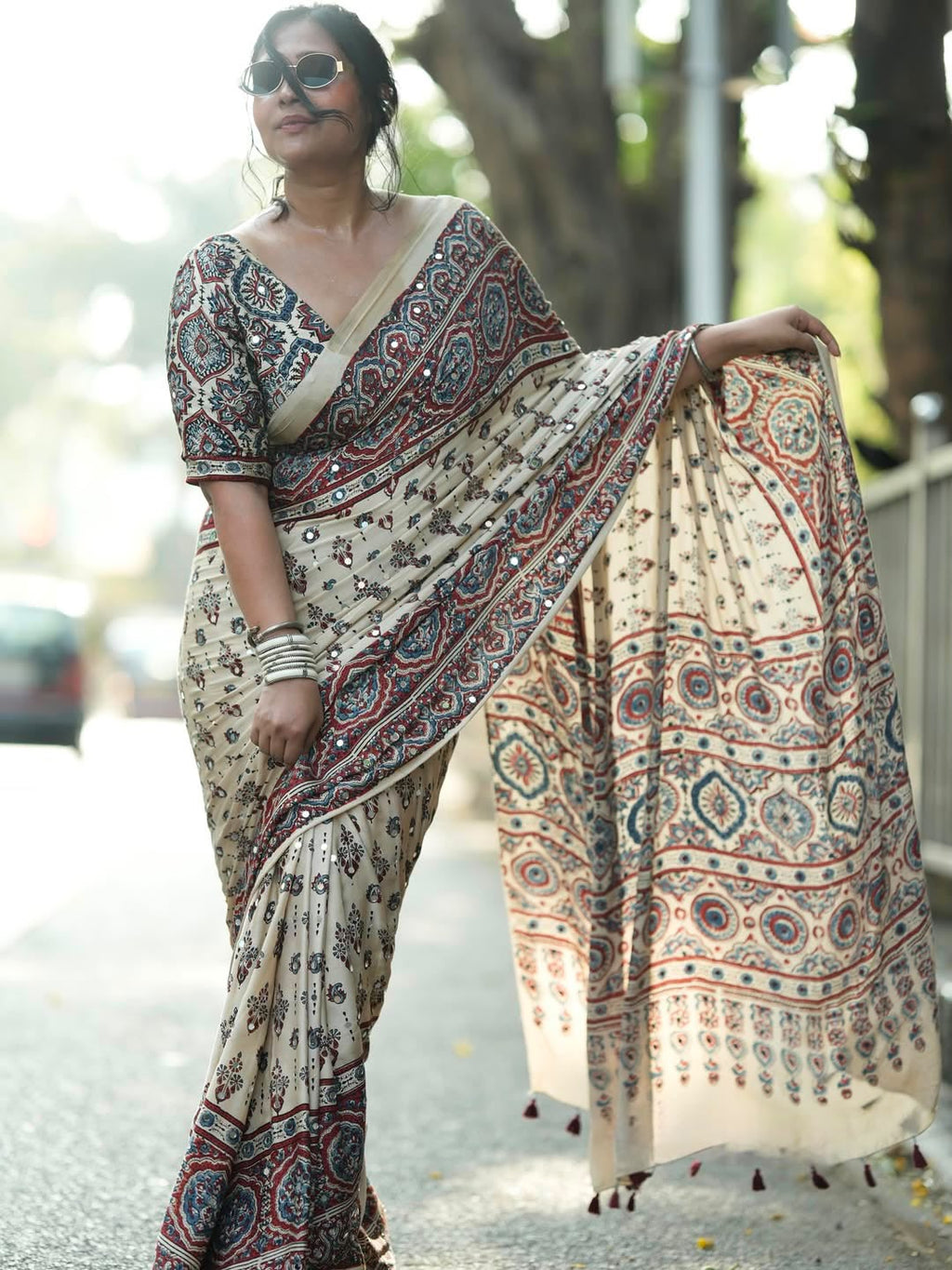 Designer Cream Printed Saree with Traditional Motifs, Border & Tassel Detailing