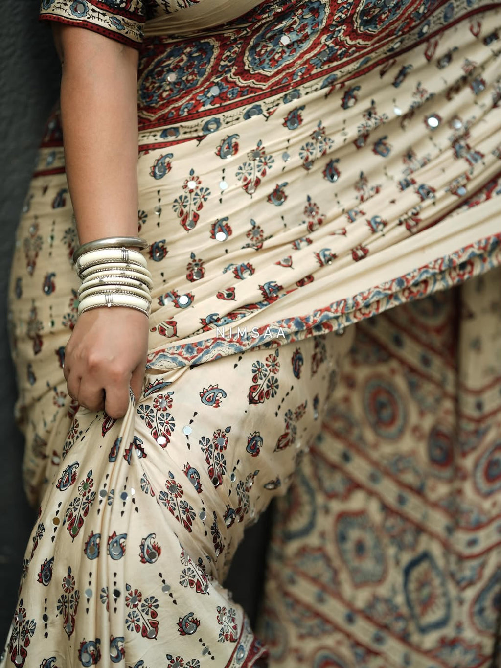 Designer Cream Printed Saree with Traditional Motifs, Border & Tassel Detailing