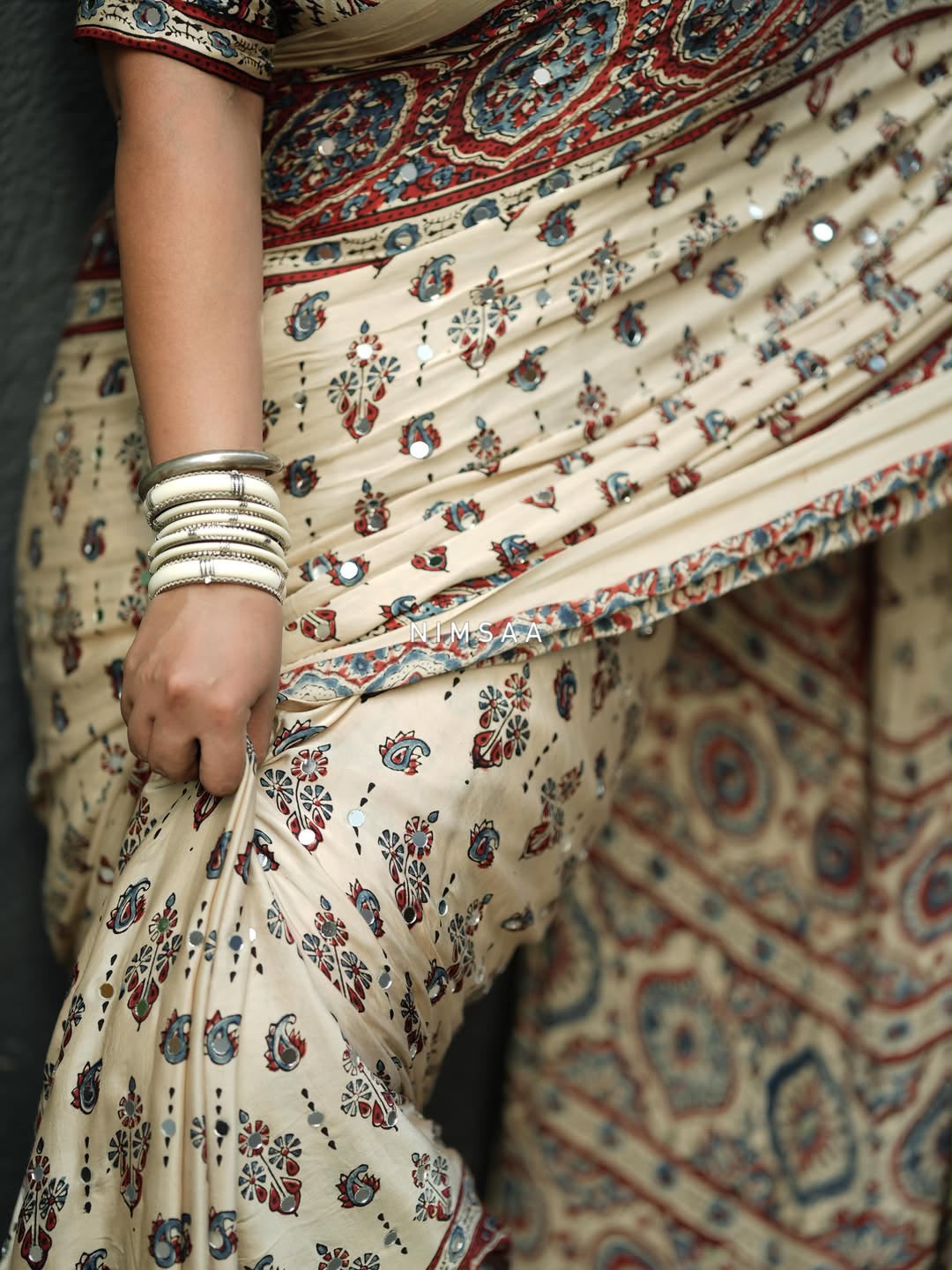 Designer Cream Printed Saree with Traditional Motifs, Border & Tassel Detailing