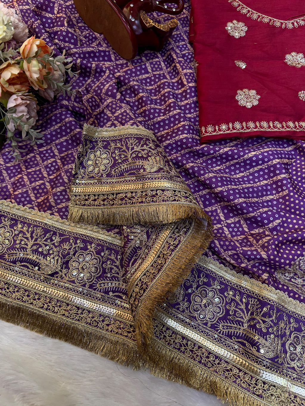 Royal Purple Bandhani-Style Printed Saree with Intricate Golden Embroidered Border & Tassel Detailing