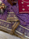 Royal Purple Bandhani-Style Printed Saree with Intricate Golden Embroidered Border & Tassel Detailing