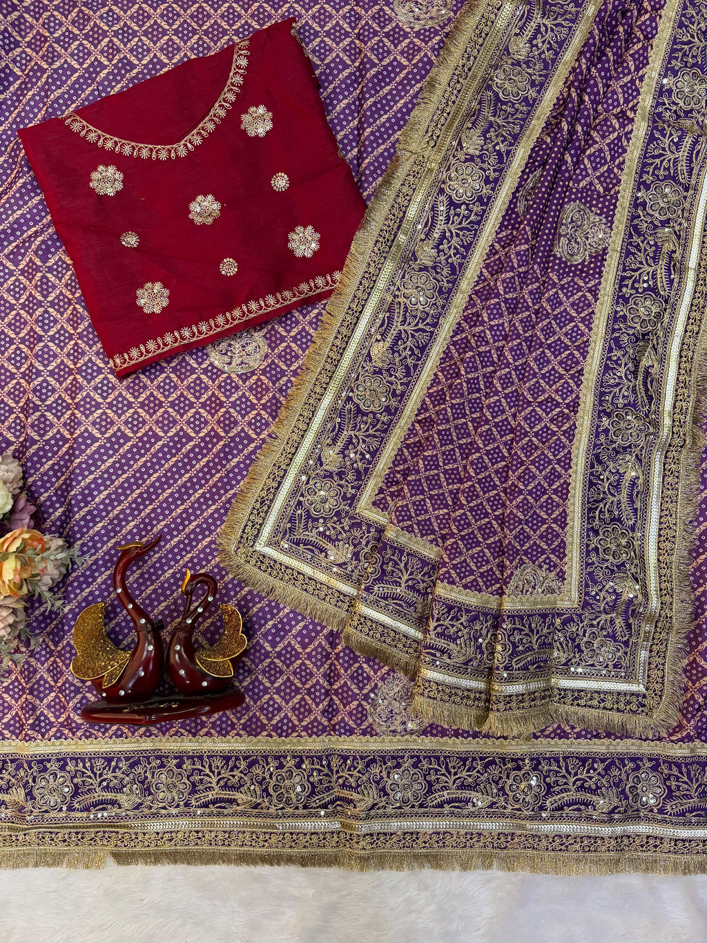Royal Purple Bandhani-Style Printed Saree with Intricate Golden Embroidered Border & Tassel Detailing